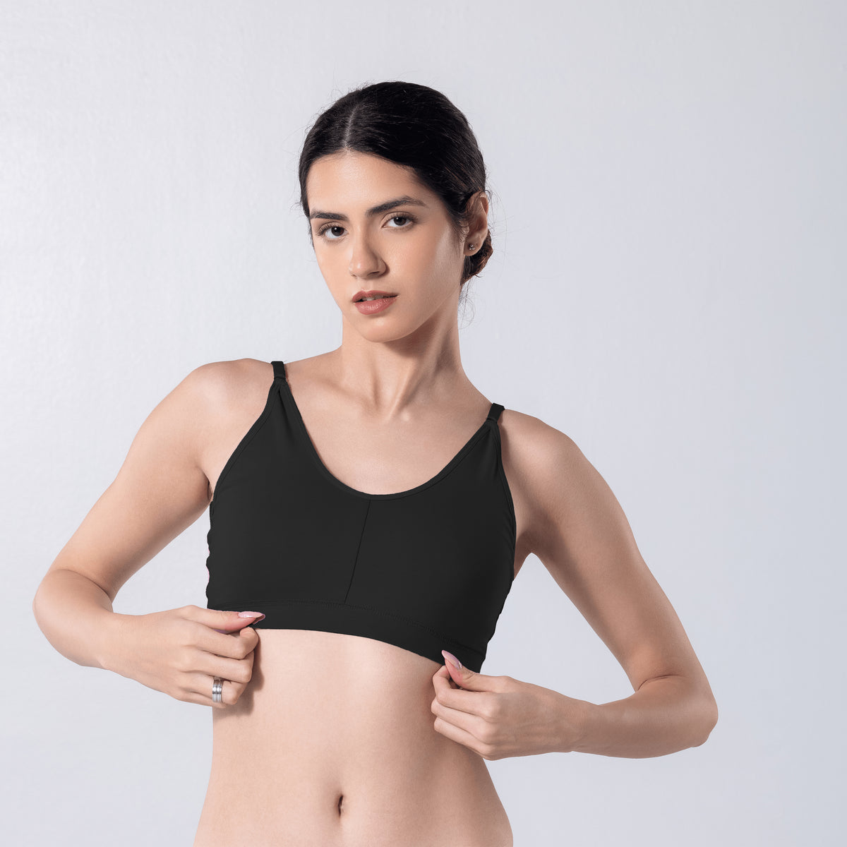 Feel Active Bra in Black, detailed shot worn by model.