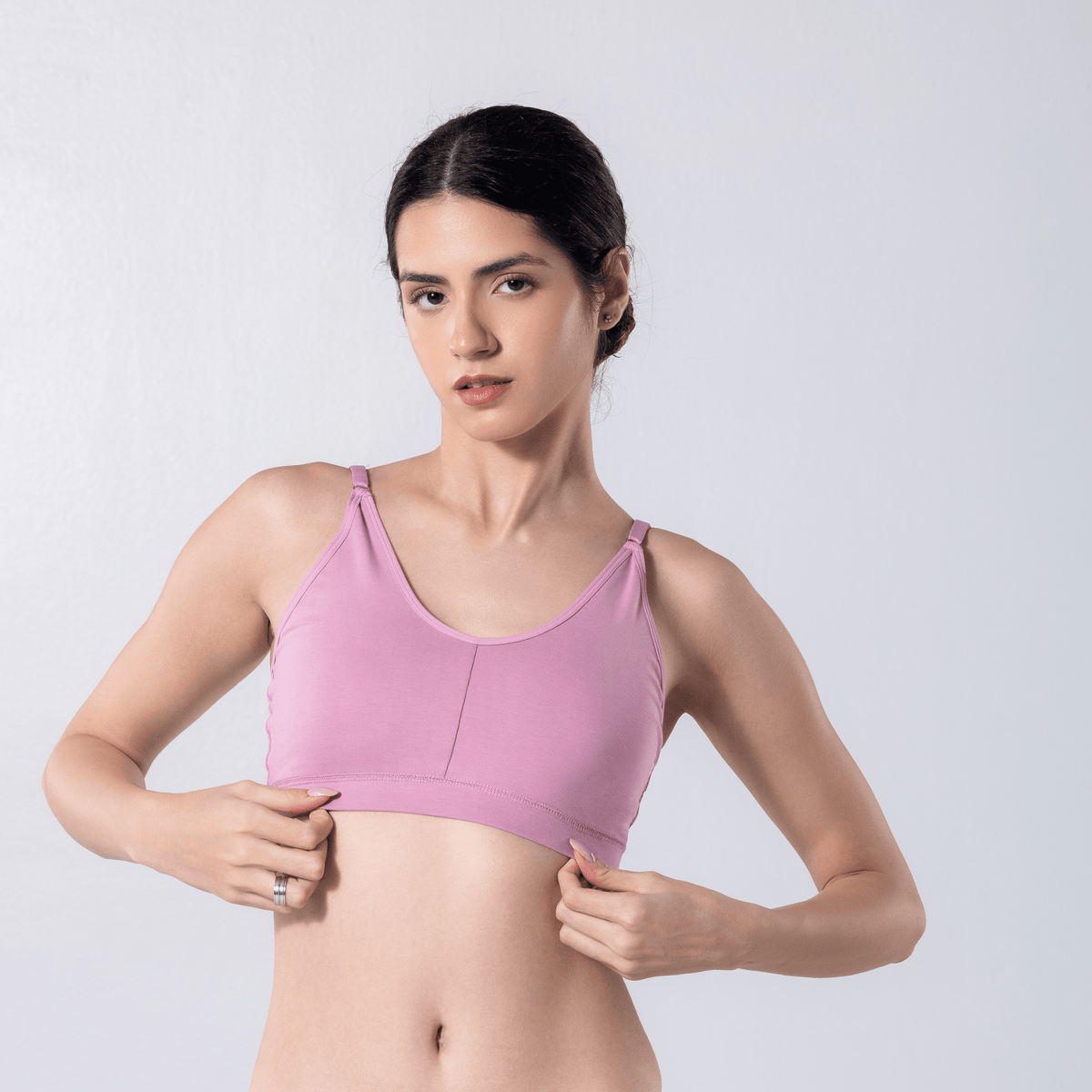 Feel Active Bra in Snow Pink, detailed shot worn by model.