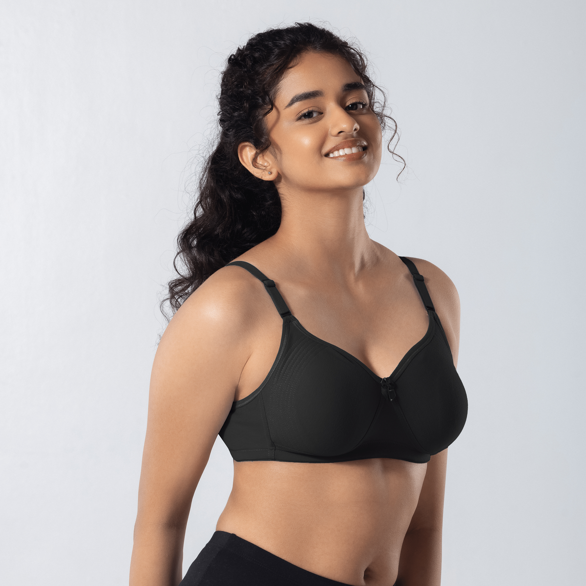 Emika-C Plus Bra in DK Grey, side-front view worn by model.