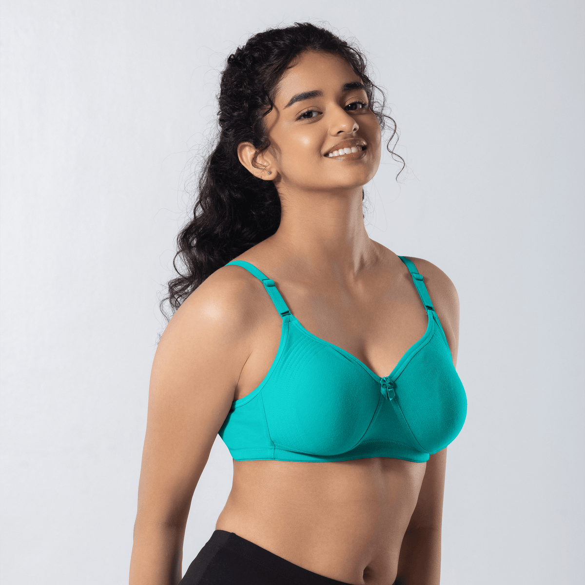 Emika-C Plus Bra in Pastel Green, side-front view worn by model.