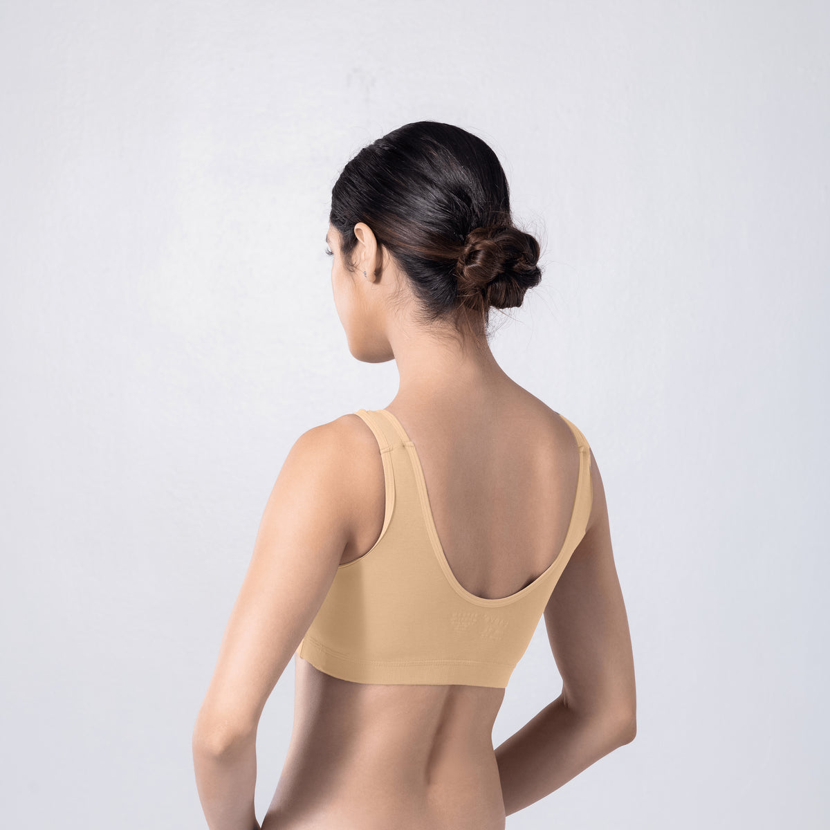 LadyO Cool Active Bra in Skin, three-quarter back view worn by model.