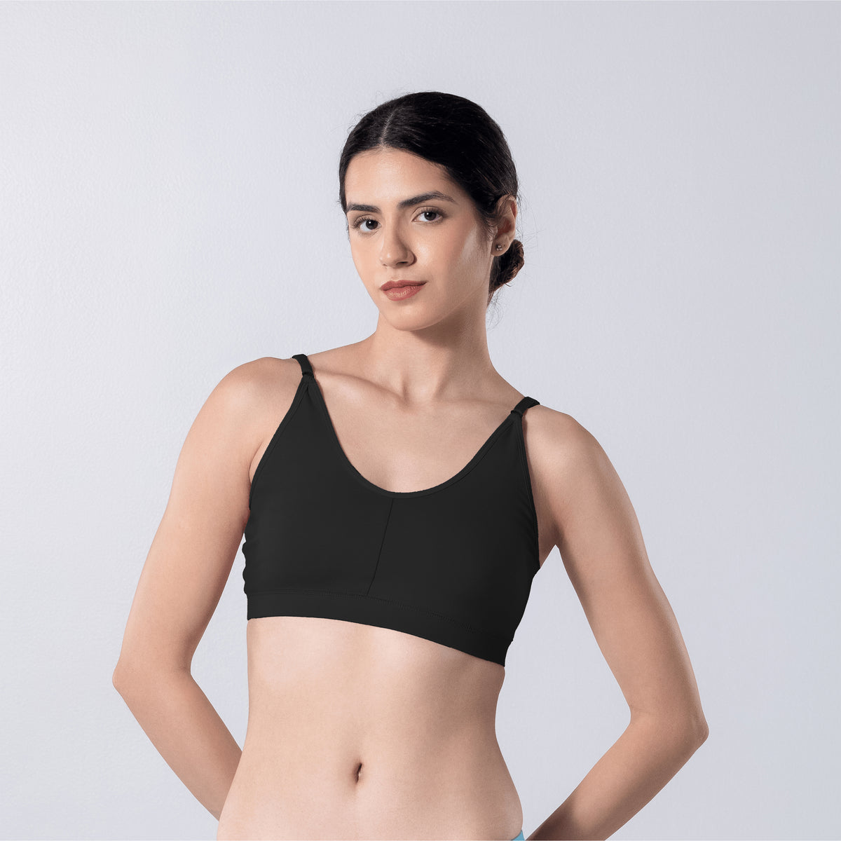 Feel Active Bra in Black, front view worn by model.
