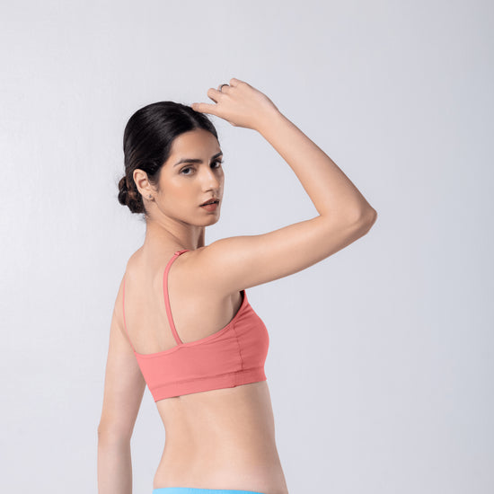 Feel Active Bra in Copper, side view worn by model.