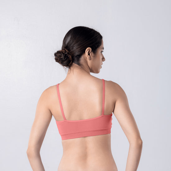 Feel Active Bra in Copper, back view worn by model.
