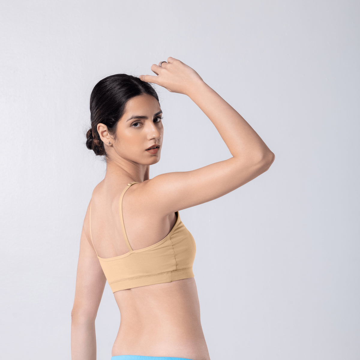 Feel Active Bra in Skin, side view worn by model.