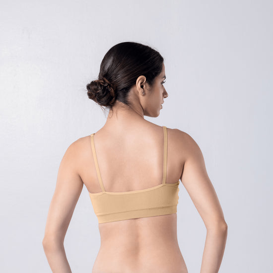 Feel Active Bra in Skin, back view worn by model.