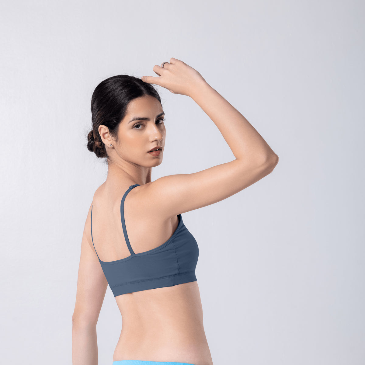 Feel Active Bra in Steel Grey, side view worn by model.