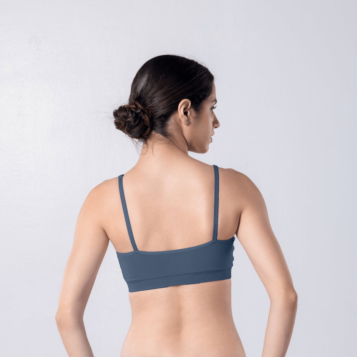 Feel Active Bra in Steel Grey, back view worn by model.