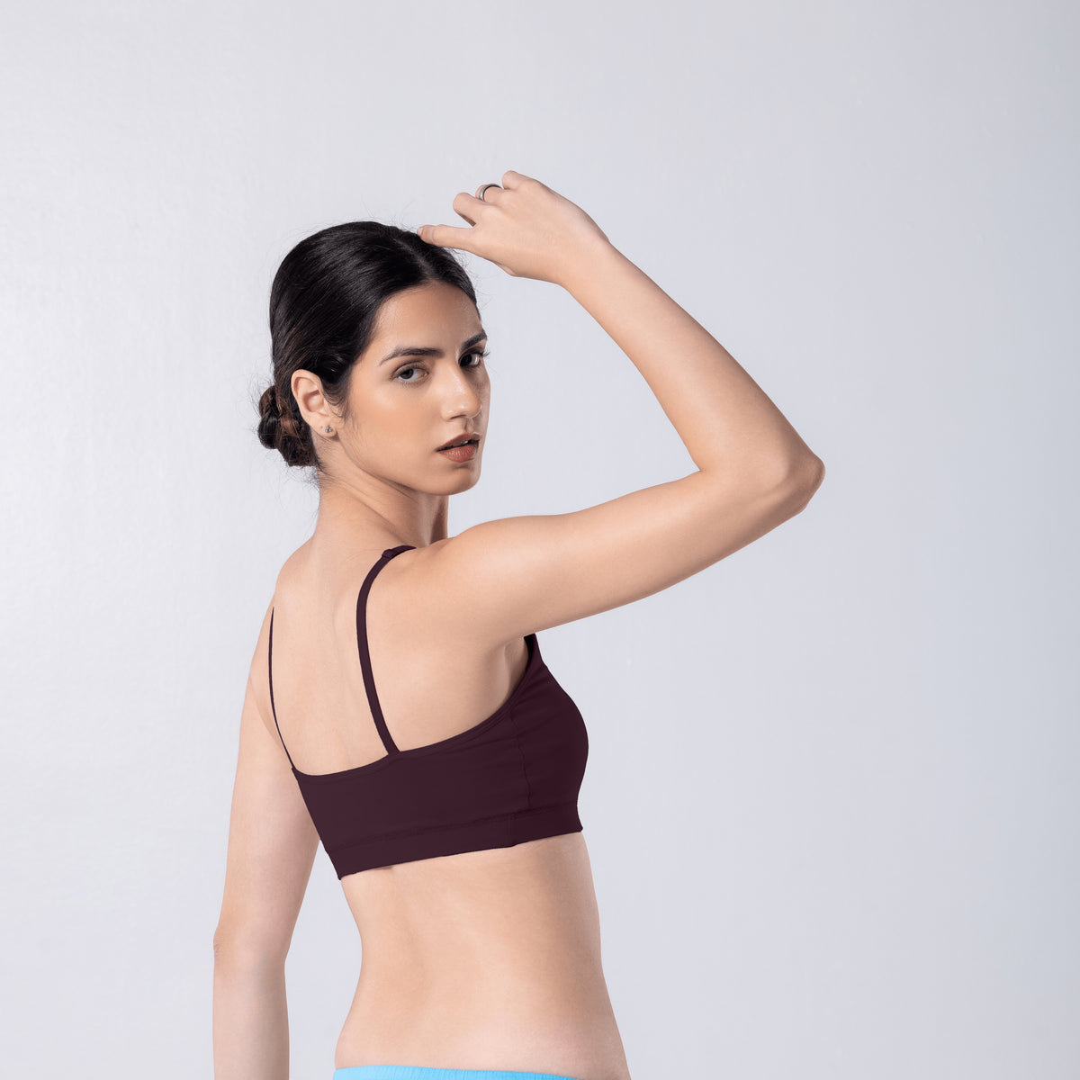Feel Active Bra in Wine, side view worn by model.