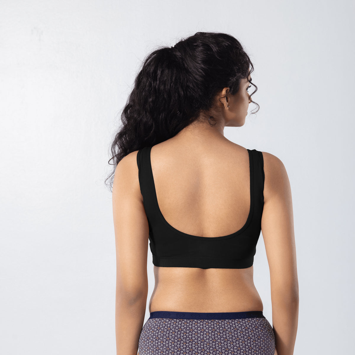 U-Back (N) Active Bra in Black, back view worn by model.