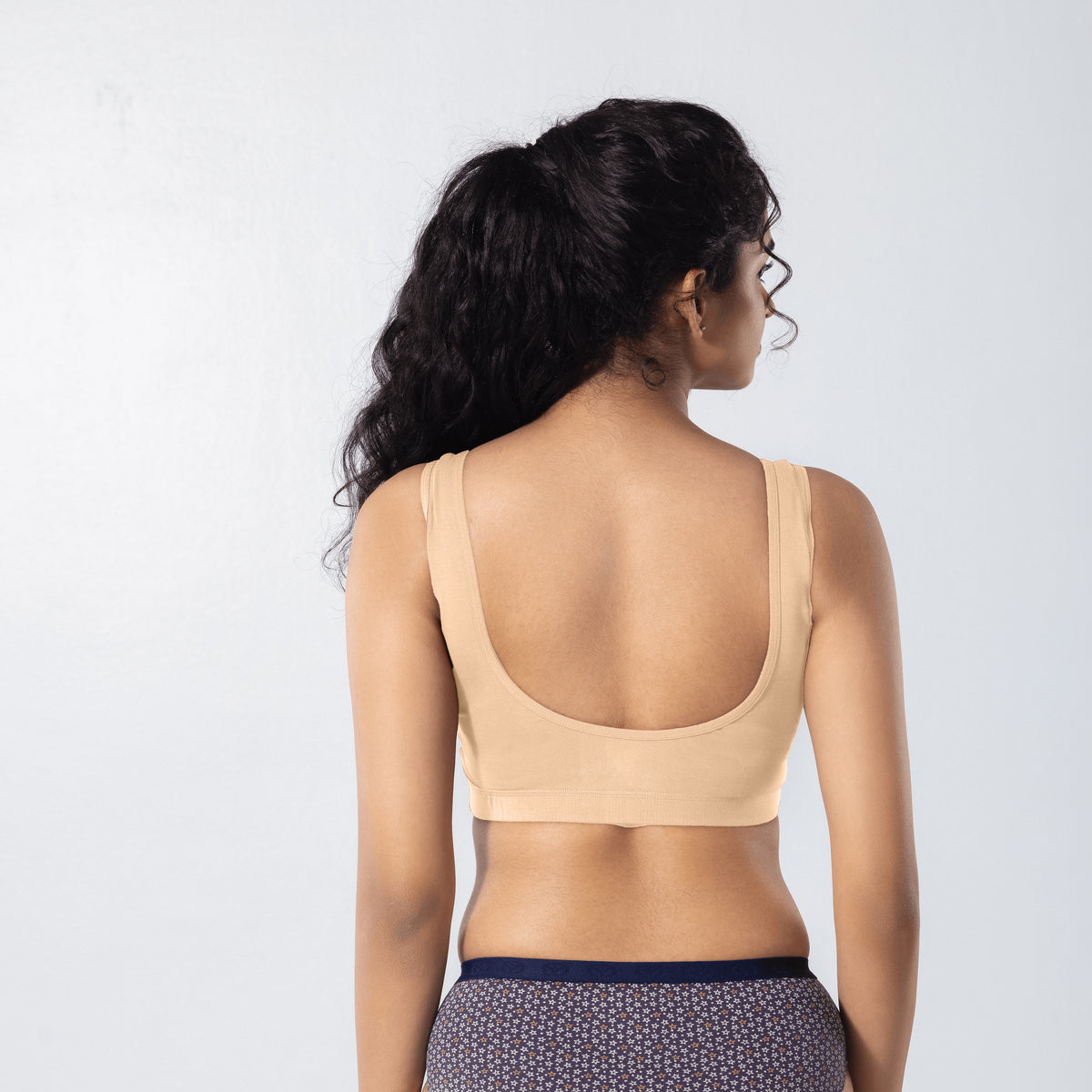U-Back (N) Active Bra in Skin, back view worn by model.