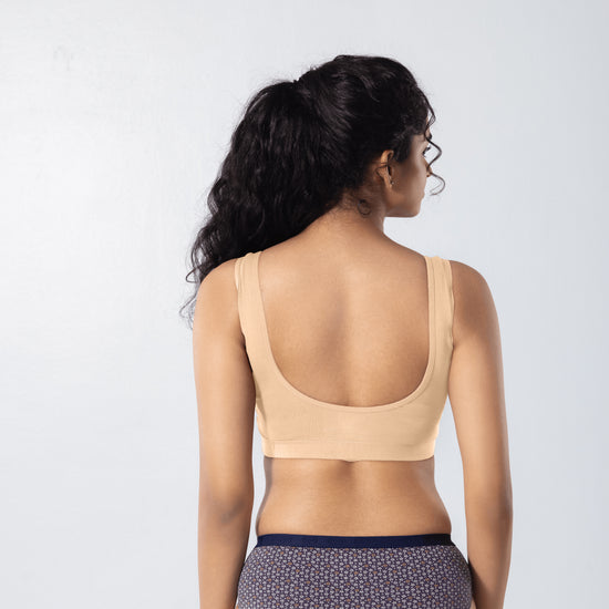 U-Back (N) Active Bra in Skin, back view worn by model.