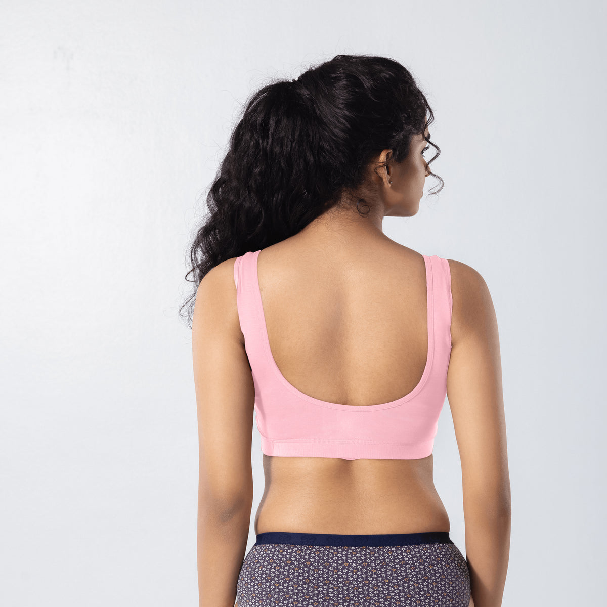 U-Back (N) Active Bra in Snow Pink, back view worn by model.