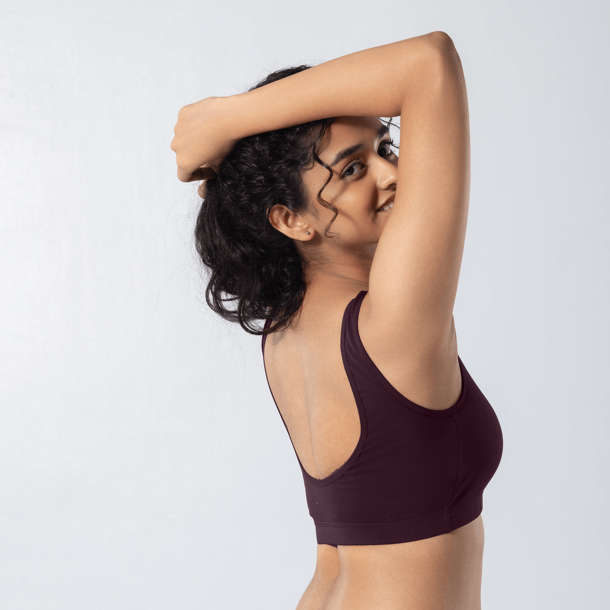 U-Back (N) Active Bra in Wine, side view worn by model.