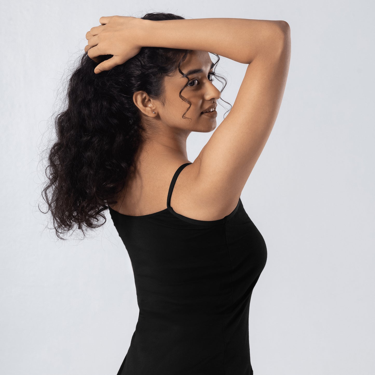LadyO Alexa-H Half Length Slip in Black, three-quarter back view worn by model.