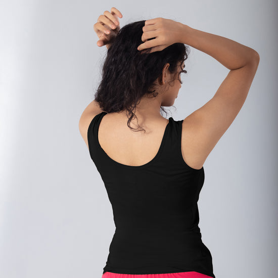 LadyO Petal (N) Mid Length Tank Top in Black, three-quarter back view worn by model.