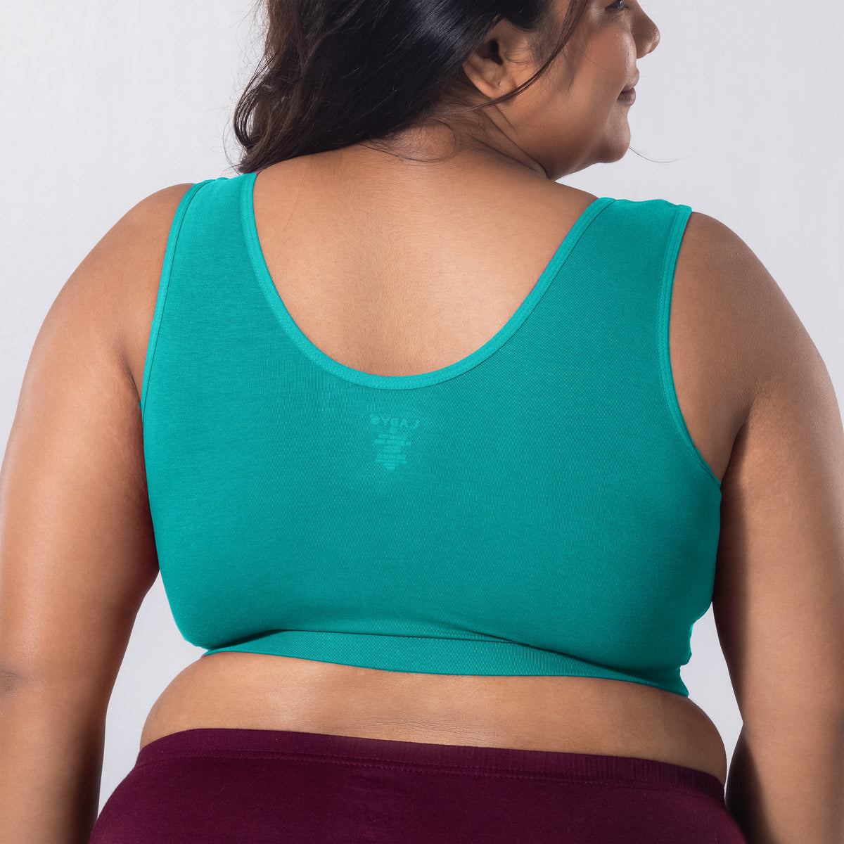 Sleeping Bra in Pastel Green, back view worn by model.
