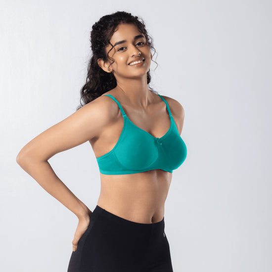 Mabel Soft Padded Bra in Pastel Green side-front view worn by model.