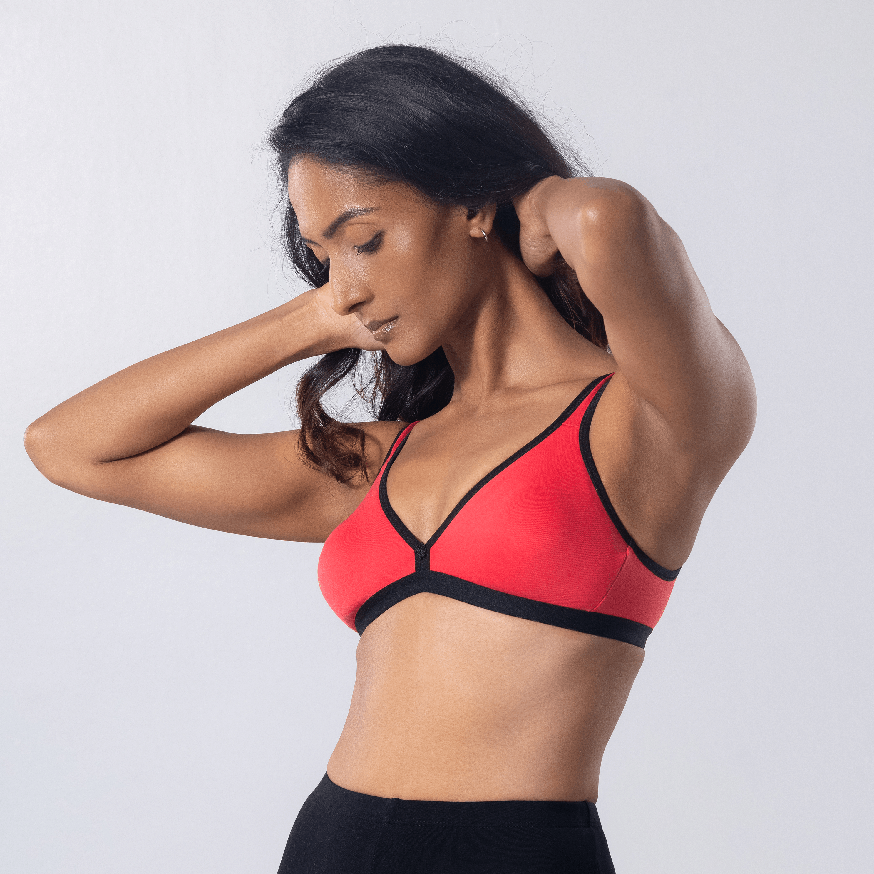 Grace Trendy Bra in Carrot, side view worn by model.