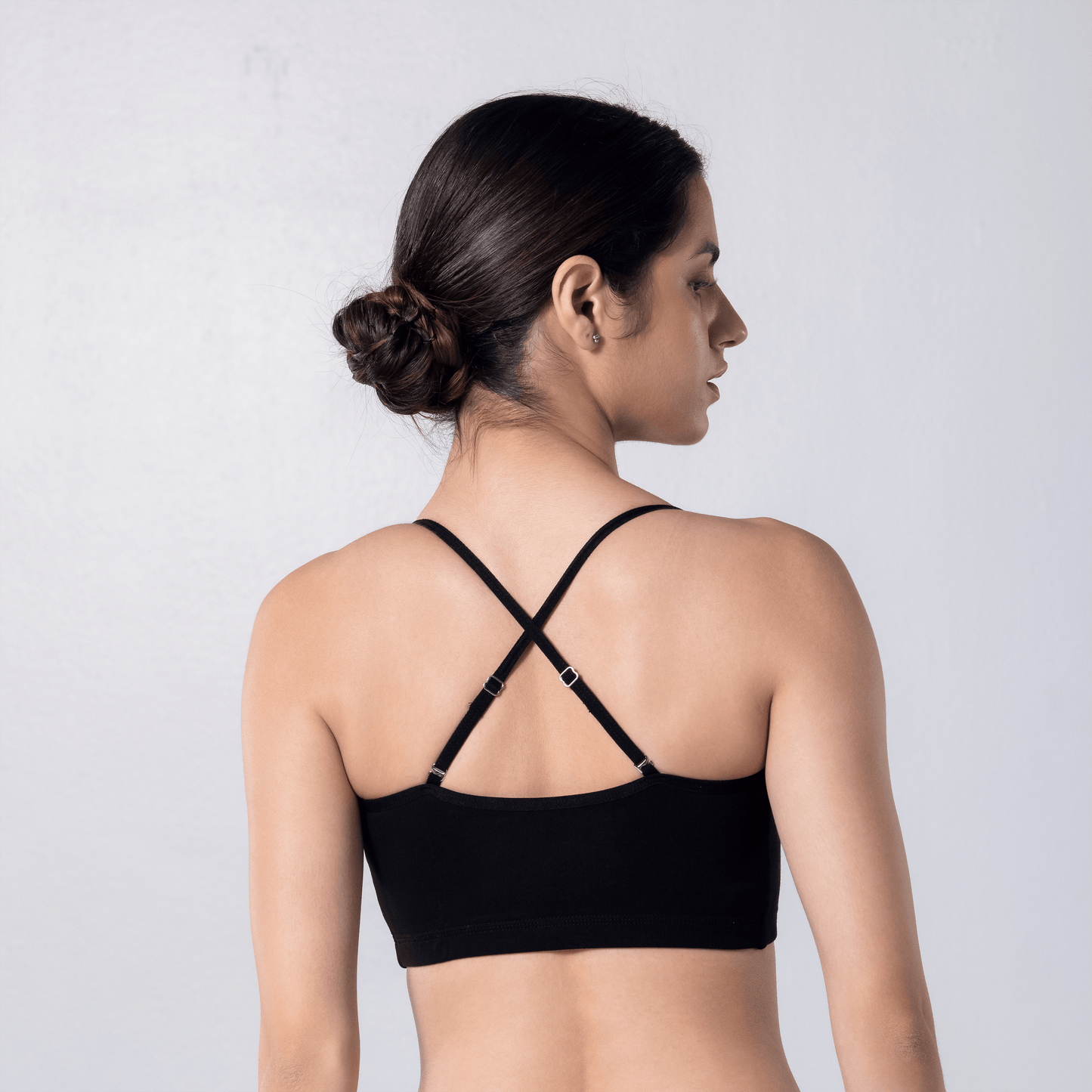 Blush Trendy Top Bra in Black, X-back view worn by model.