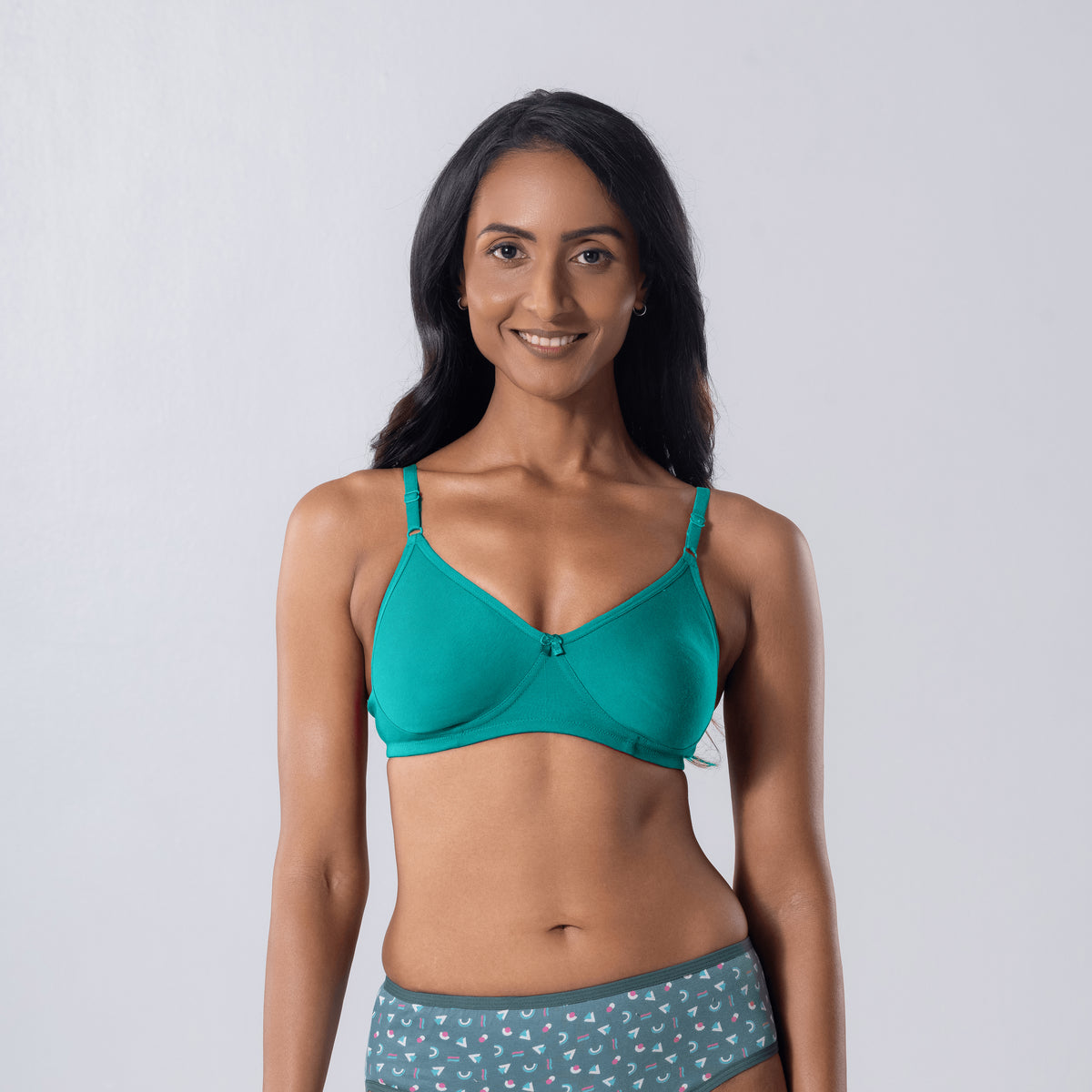 LadyO Zara T-shirt Bra in pastel green with adjustable straps, front view worn by model.